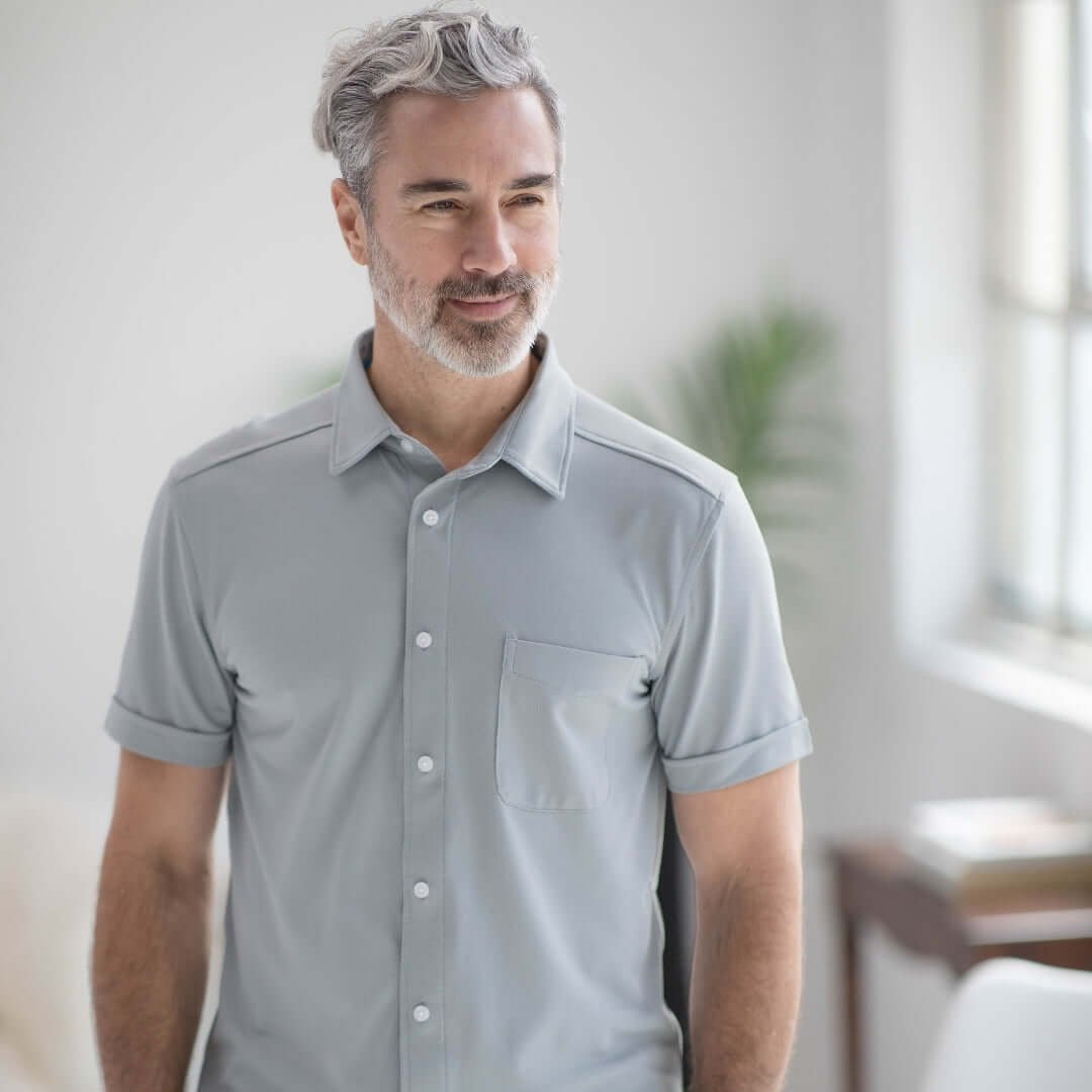 Adaptive cooling magnetic shirt in grey, designed for comfort and independence for users with limited mobility.