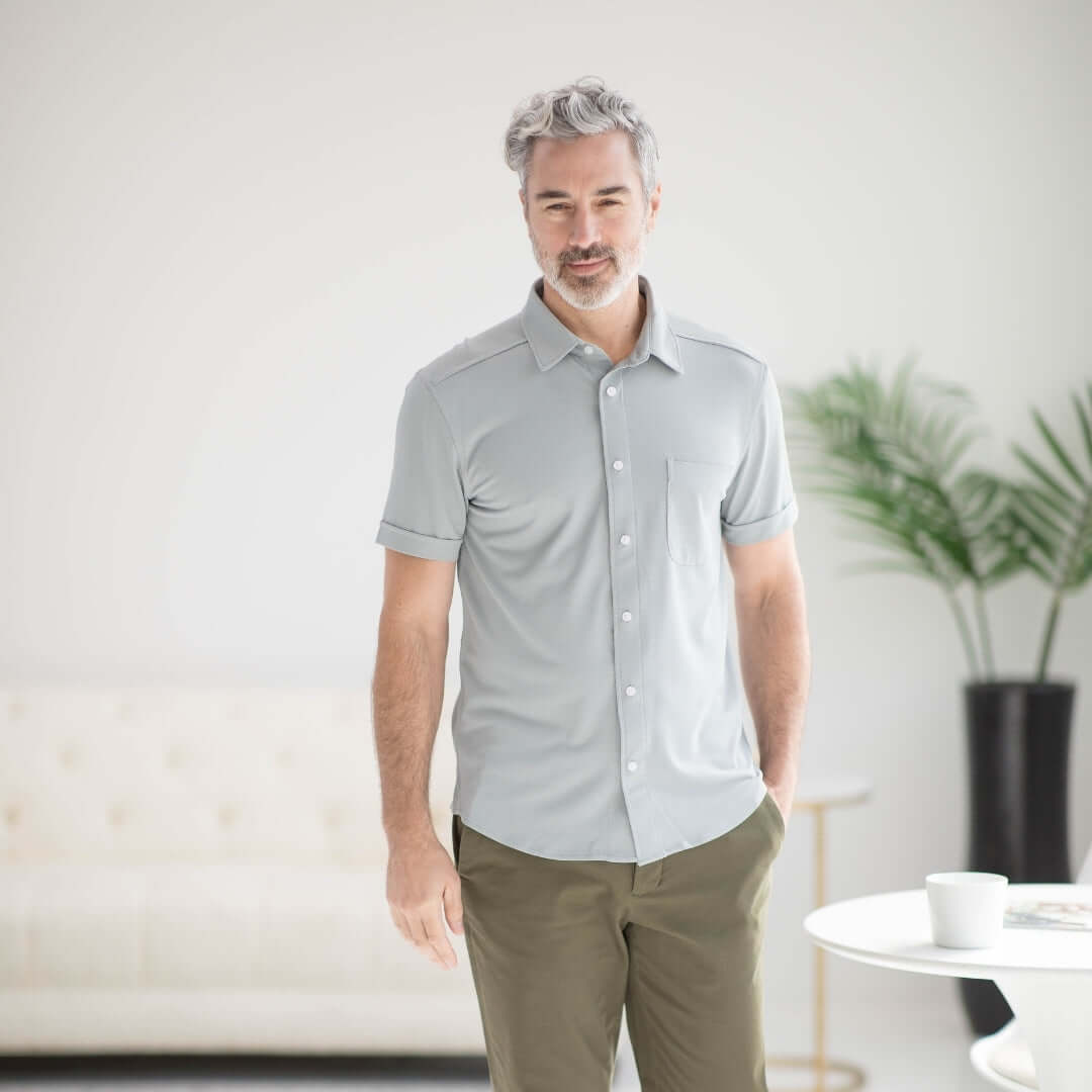 Grey adaptive cooling magnetic front short sleeves shirt for individuals with limited mobility.