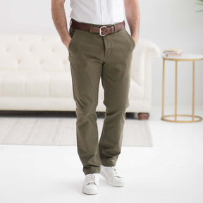 Olive flat front adaptive chino twill pant with magnetic closures, designed for mobility-limiting conditions.