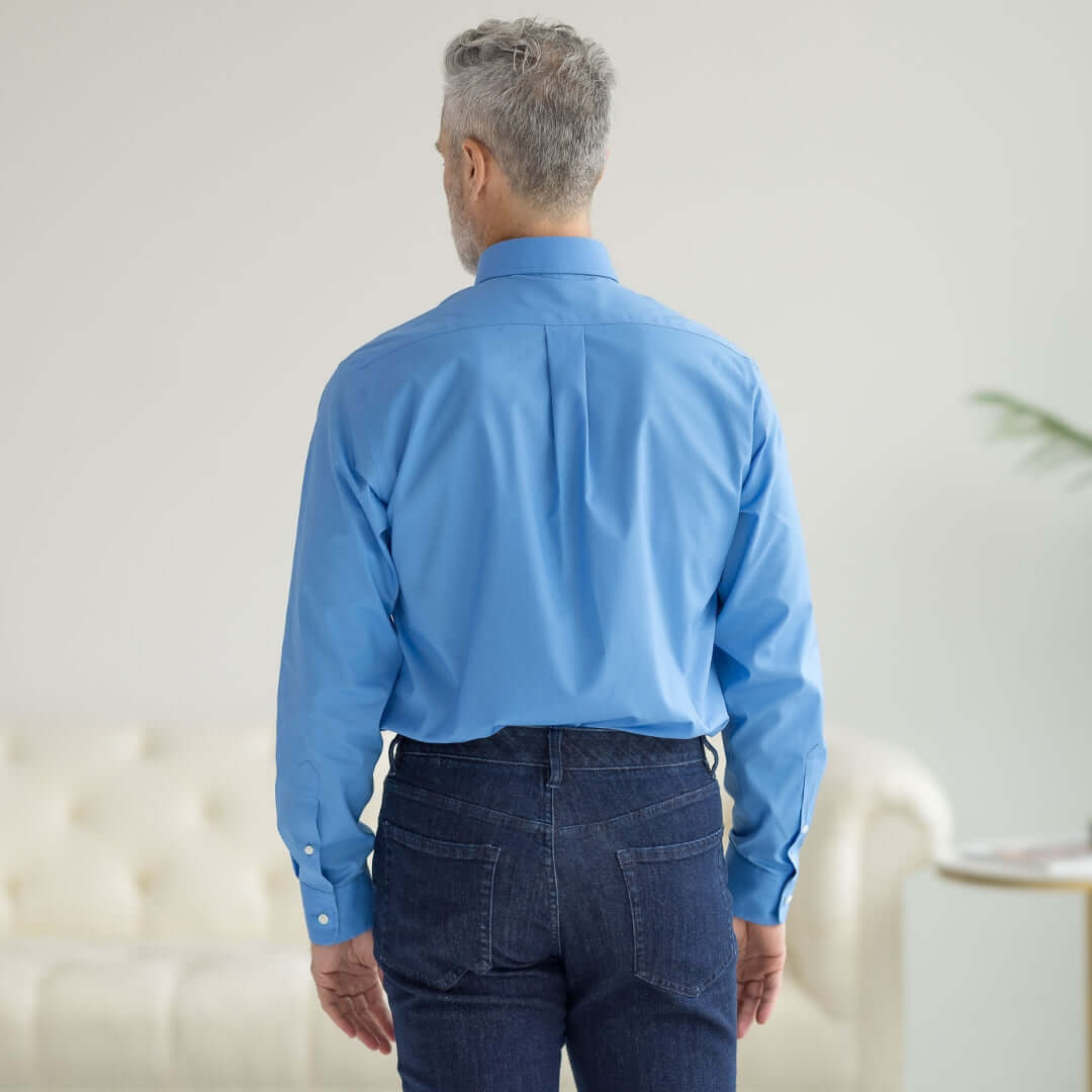 Back view of a man wearing a blue long sleeve button-down collar shirt, showcasing its classic design and fit.