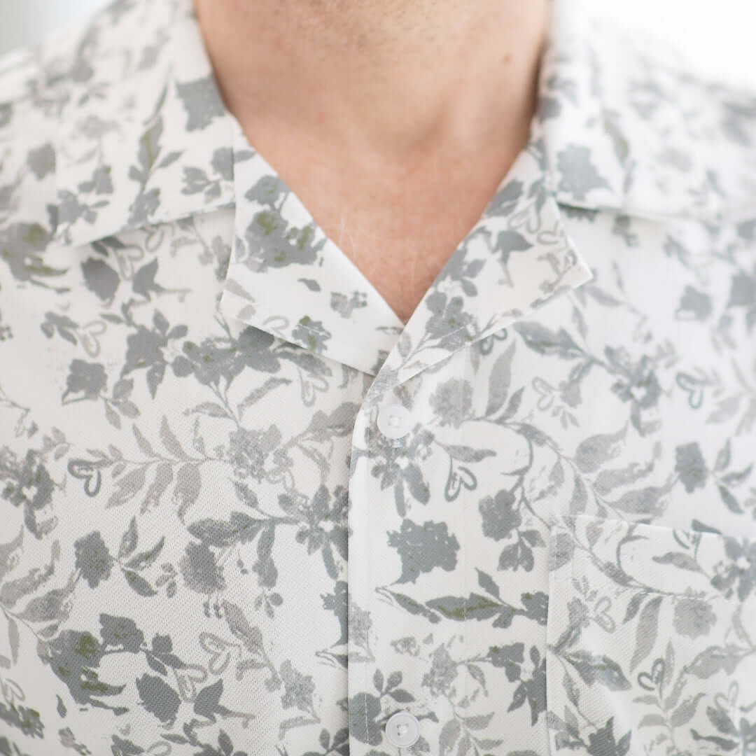 Close-up of a grey floral short sleeve casual shirt designed for comfort and accessibility.